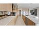 Contemporary kitchen has long counters, modern appliances, and streamlined wooden cabinetry at 40 Heron Harbour Dr, Henderson, NV 89011