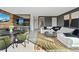 Open-concept living area with modern seating, media features, and stylish decor at 40 Heron Harbour Dr, Henderson, NV 89011