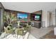 Inviting living area with a dining table, built-in bar, and comfortable seating at 40 Heron Harbour Dr, Henderson, NV 89011