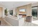 Bright living room featuring a modern fireplace, comfortable seating, and an open layout with lots of natural light at 40 Heron Harbour Dr, Henderson, NV 89011