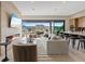 Bright living room boasts a cozy fireplace, modern furniture, and a scenic outdoor view at 40 Heron Harbour Dr, Henderson, NV 89011