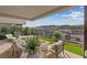Inviting outdoor patio with a fire pit, plush seating, and scenic views of the mountains and city at 40 Heron Harbour Dr, Henderson, NV 89011
