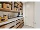 Organized pantry featuring wooden shelves and drawers provides ample storage space at 40 Heron Harbour Dr, Henderson, NV 89011