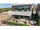 A modern patio with outdoor seating, a fire pit, and manicured landscaping at 40 Heron Harbour Dr, Henderson, NV 89011