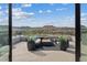 Stylish rooftop deck with modern outdoor furniture, a fire pit and beautiful mountain views at 40 Heron Harbour Dr, Henderson, NV 89011