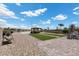 A spacious backyard with a gazebo, pool, and various seating areas at 4030 Midnight Crest Ave, North Las Vegas, NV 89031