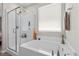 Bathroom featuring glass-enclosed shower and separate tub at 4030 Midnight Crest Ave, North Las Vegas, NV 89031