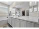 Bathroom vanity boasts double sinks and a large mirror, with abundant natural light at 4030 Midnight Crest Ave, North Las Vegas, NV 89031