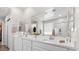 Bathroom with dual sinks, large mirror, and separate shower at 4030 Midnight Crest Ave, North Las Vegas, NV 89031