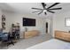 Spacious bedroom with a ceiling fan, carpet floors, and a walk-in closet at 4030 Midnight Crest Ave, North Las Vegas, NV 89031