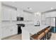 Bright kitchen featuring white cabinets, a center island with seating, and stainless appliances at 4030 Midnight Crest Ave, North Las Vegas, NV 89031