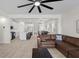 Bright living room features hardwood floors and an open view into the kitchen and dining area at 4030 Midnight Crest Ave, North Las Vegas, NV 89031