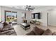 Bright living room with access to an outdoor patio and a mounted television at 4030 Midnight Crest Ave, North Las Vegas, NV 89031