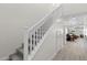Carpeted staircase with white railing, leading to an open floor plan at 4030 Midnight Crest Ave, North Las Vegas, NV 89031