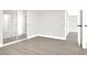 Primary bedroom featuring luxury floors, a glass paneled shower, and a walk-in closet at 417 N Lamb Blvd # E, Las Vegas, NV 89110