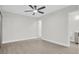 Large bedroom showing wood-look floors, a ceiling fan, and an ensuite bathroom at 417 N Lamb Blvd # E, Las Vegas, NV 89110