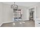 Dining room with modern lighting, vinyl flooring, and water heater access at 417 N Lamb Blvd # E, Las Vegas, NV 89110