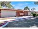 Cozy single-story home with gated courtyard, desert landscaping, and red trim at 417 N Lamb Blvd # E, Las Vegas, NV 89110