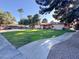 Multi-Gathering home with lush green lawn and mature trees, plus parking at 417 N Lamb Blvd # E, Las Vegas, NV 89110