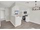 Updated kitchen with white cabinets, modern appliances, and breakfast bar at 417 N Lamb Blvd # E, Las Vegas, NV 89110