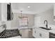 Bright kitchen with updated cabinets, countertops, stainless appliances, and a view to the backyard at 417 N Lamb Blvd # E, Las Vegas, NV 89110