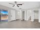 Open living space with vinyl floors and a sliding glass door at 417 N Lamb Blvd # E, Las Vegas, NV 89110