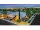 Stunning aerial view of a property showcasing its beautiful landscaping and proximity to the city lights at 4286 Pacifico Ln, Las Vegas, NV 89135