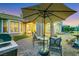 Lush backyard, perfect for entertaining, with a seating area, barbecue, water feature, and outdoor shade at 4286 Pacifico Ln, Las Vegas, NV 89135