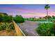 Lush backyard with scenic golf course views, mature trees, and beautiful desert landscaping at 4286 Pacifico Ln, Las Vegas, NV 89135