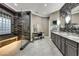 Elegant bathroom featuring a large glass shower and dual vanity at 4286 Pacifico Ln, Las Vegas, NV 89135