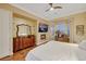 Bright bedroom with a bay window, fireplace, and elegant wooden dresser at 4286 Pacifico Ln, Las Vegas, NV 89135