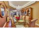 Luxurious dining room with glass table, chandelier, and hardwood floors providing an elegant space for dining at 4286 Pacifico Ln, Las Vegas, NV 89135