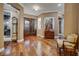 Elegant foyer featuring gleaming hardwood floors, ornate front doors, and sophisticated decor at 4286 Pacifico Ln, Las Vegas, NV 89135