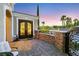 An elegant front entryway featuring pavers and ornamental ironwork at 4286 Pacifico Ln, Las Vegas, NV 89135
