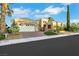 Stunning single-story home featuring well-manicured landscaping, a spacious garage, and a brick driveway at 4286 Pacifico Ln, Las Vegas, NV 89135