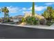 Inviting single-story home featuring mature trees, lush landscaping, and a well-maintained lawn at 4286 Pacifico Ln, Las Vegas, NV 89135