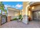 Inviting front porch area with ornate gate, a seating area, and direct access to the front door at 4286 Pacifico Ln, Las Vegas, NV 89135