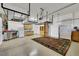 A spacious garage featuring overhead storage racks, a service sink and ample space at 4286 Pacifico Ln, Las Vegas, NV 89135