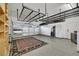 Spacious garage includes overhead storage racks and ample room for parking at 4286 Pacifico Ln, Las Vegas, NV 89135