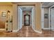 Inviting hallway showcasing gleaming hardwood floors, neutral walls and stylish furnishings that add to its charm at 4286 Pacifico Ln, Las Vegas, NV 89135
