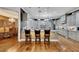 Gourmet kitchen with granite counters, hardwood floors, and stainless appliances providing a chef's dream workspace at 4286 Pacifico Ln, Las Vegas, NV 89135