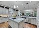 Bright, modern kitchen with granite counters, hardwood floors, and stainless steel appliances offers style and functionality at 4286 Pacifico Ln, Las Vegas, NV 89135