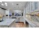 Bright kitchen featuring granite countertops, custom cabinets, stainless steel appliances, and hardwood flooring at 4286 Pacifico Ln, Las Vegas, NV 89135