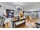 Open concept kitchen and dining area with hardwood floors and modern decor at 4286 Pacifico Ln, Las Vegas, NV 89135