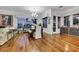 Bright open floorplan features hardwood floors, dining table, and a comfortable living area at 4286 Pacifico Ln, Las Vegas, NV 89135