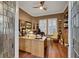 A home office features built-in shelving, a large desk, and natural light at 4286 Pacifico Ln, Las Vegas, NV 89135