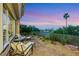 Inviting outdoor patio featuring stylish seating, lush landscaping, and a serene view at 4286 Pacifico Ln, Las Vegas, NV 89135
