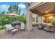 Outdoor patio featuring a large BBQ, seating area, and shade umbrella at 4286 Pacifico Ln, Las Vegas, NV 89135