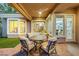 Charming outdoor patio with a ceiling fan, comfortable seating, and views of the interior at 4286 Pacifico Ln, Las Vegas, NV 89135