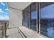 Balcony with expansive city and mountain views, featuring glass railings and sliding glass doors at 4381 W Flamingo Rd # 3809, Las Vegas, NV 89103